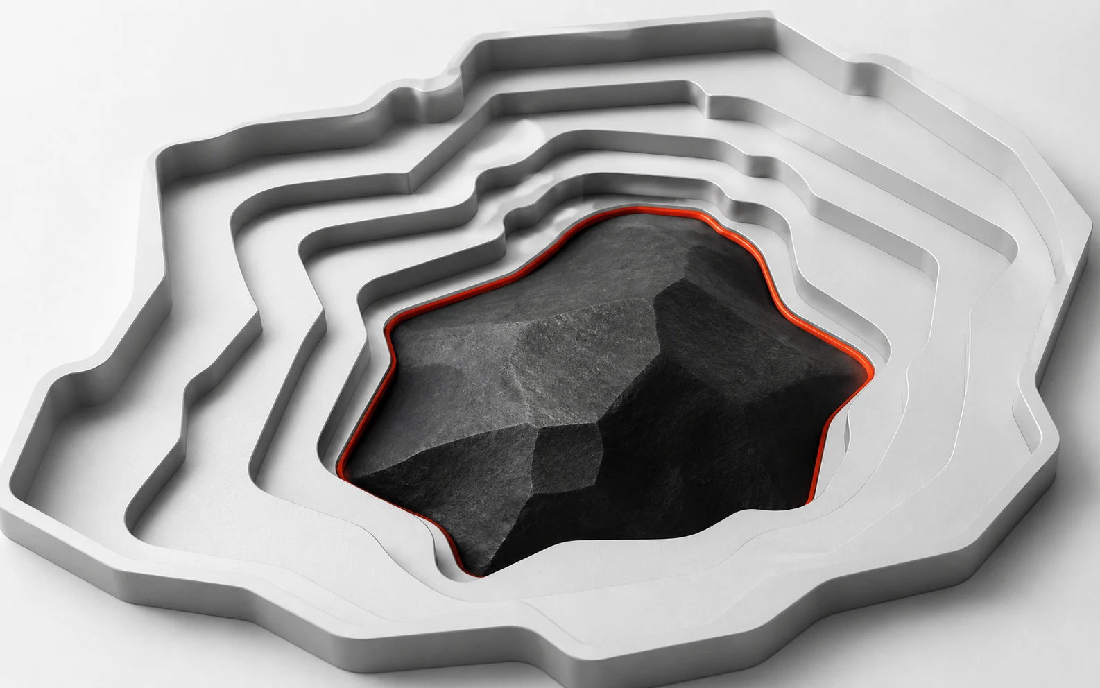 Nested aluminium apertures conform around an irregular carbon form with a precise vermilion boundary.