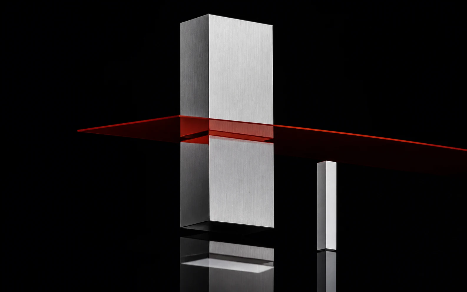 A vermilion datum plane splits an aluminium volume so its displacement can be seen against a carbon field.